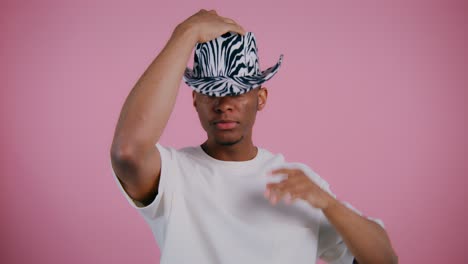 man wearing zebra print cowboy hat