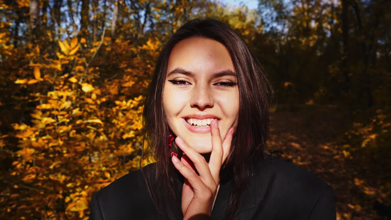 A Young Woman in Nature: Capturing the Vibrant Beauty of Autumn with Bright Leaves and a Warm Smile in Two Stunning Frames