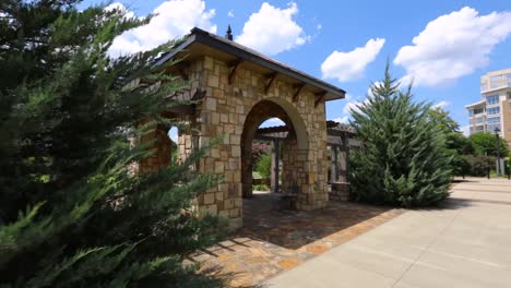 this clip is a paralax shot of a tan brick arch in midtown park in charlotte, nc