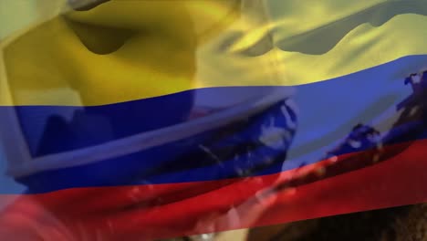 Animación-De-La-Bandera-De-Colombia-Ondeando-Sobre-Un-Hombre-Caucásico