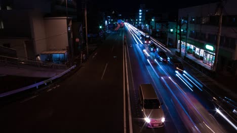 a night timelapse of the traffic jam at the city street in tokyo wide shot