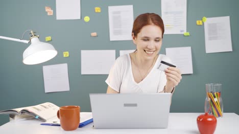 woman shopping from laptop.