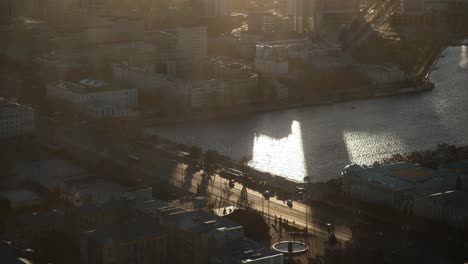 aerial view of a city at sunset with reflections