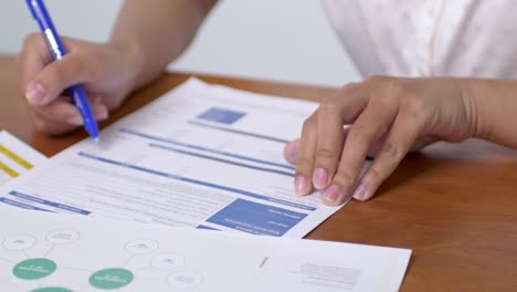 a focused individual reviews crucial business documents planning for future strategies an office environment