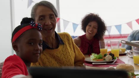 multi-generation family having celebration meal