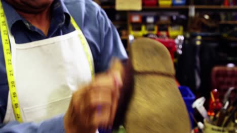 Cobbler-polishing-a-shoe