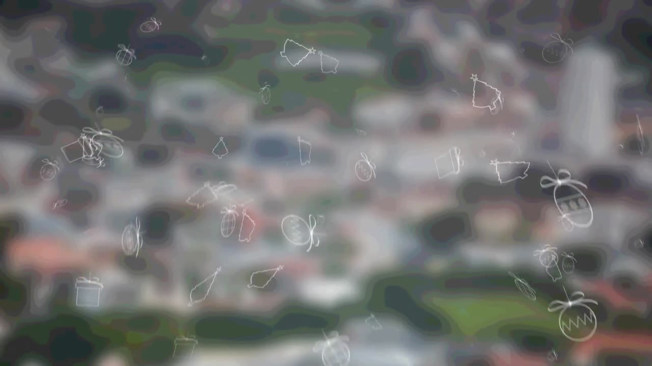 도시 풍경 위에 떨어지는 크리스마스 아이콘의 애니메이션