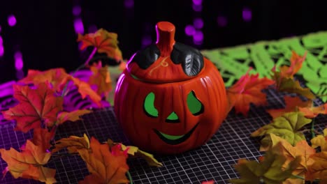 Orange-pumpkin-with-green-eyes,-cute-spooky-Halloween-decor