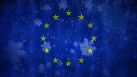 european flag with snowflakes during snowfall