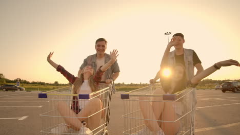 a group of young people fun ride on carts near the store supermarket