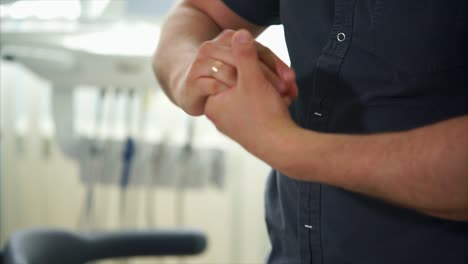 medical professional putting on gloves