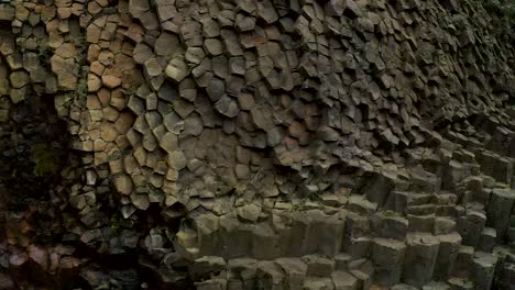 Close-up-sideways-panning-front-of-basalt-columns-cliff-showing-texture-and-shape