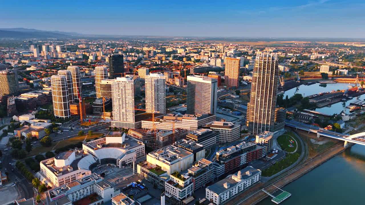 Bratislava, Slovakia, 2 June 2025: Modern skyline of Bratislava at sunset. Bratislava showcases its modern architecture with high-rise buildings and scenic riverside views during sunset