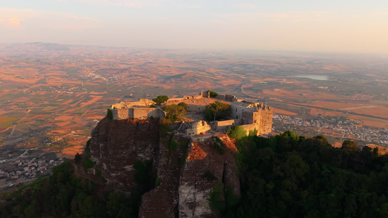 Flying Towards The Castle of Venus (Castello di Venere) During Sunset In Erice, Trapani, Italy. - aerial shot