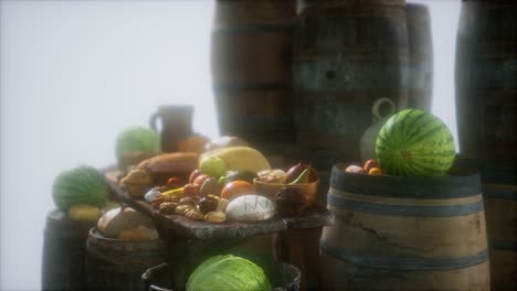 food table with wine barrels and some fruits, vegetables and bread