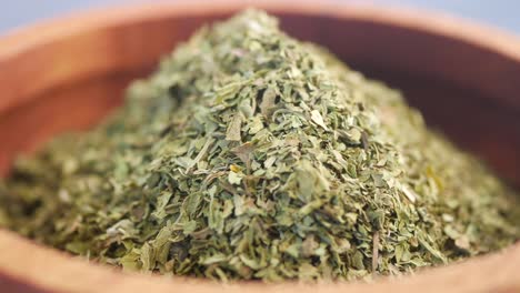 dried herbs in wooden bowl