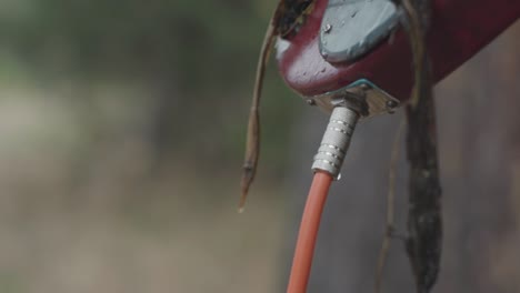 water hose attached to a red object