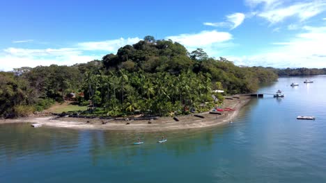 Beach-in-Costa-Rica-with-surfers-and-tourist-boats