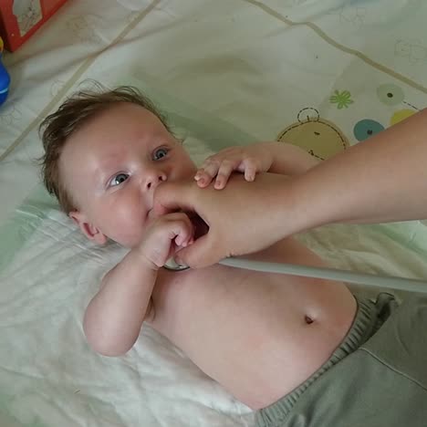 pediatrician examining baby boy