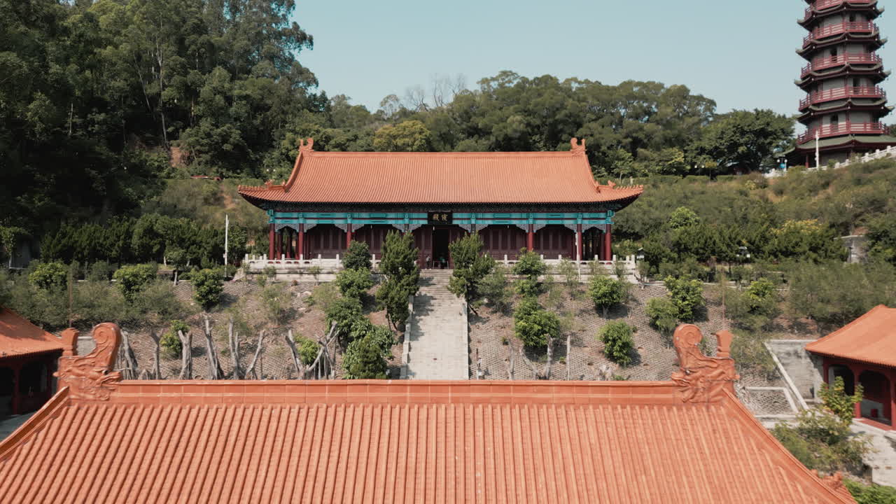 Explore Nansha Tin Hau Palace's divine beauty with an aerial orbit shot of the goddess statue in China