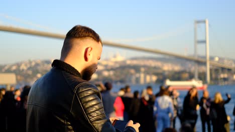 man shooting landscape with phone