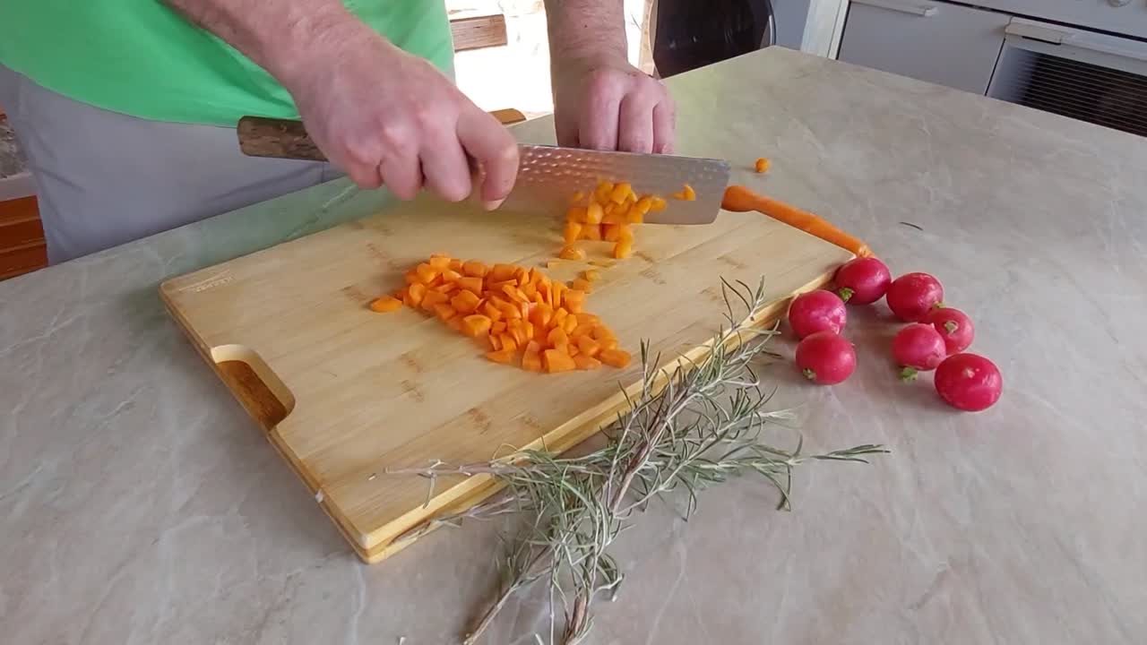 Choping Carrots into small pieces for Bolognese sauce