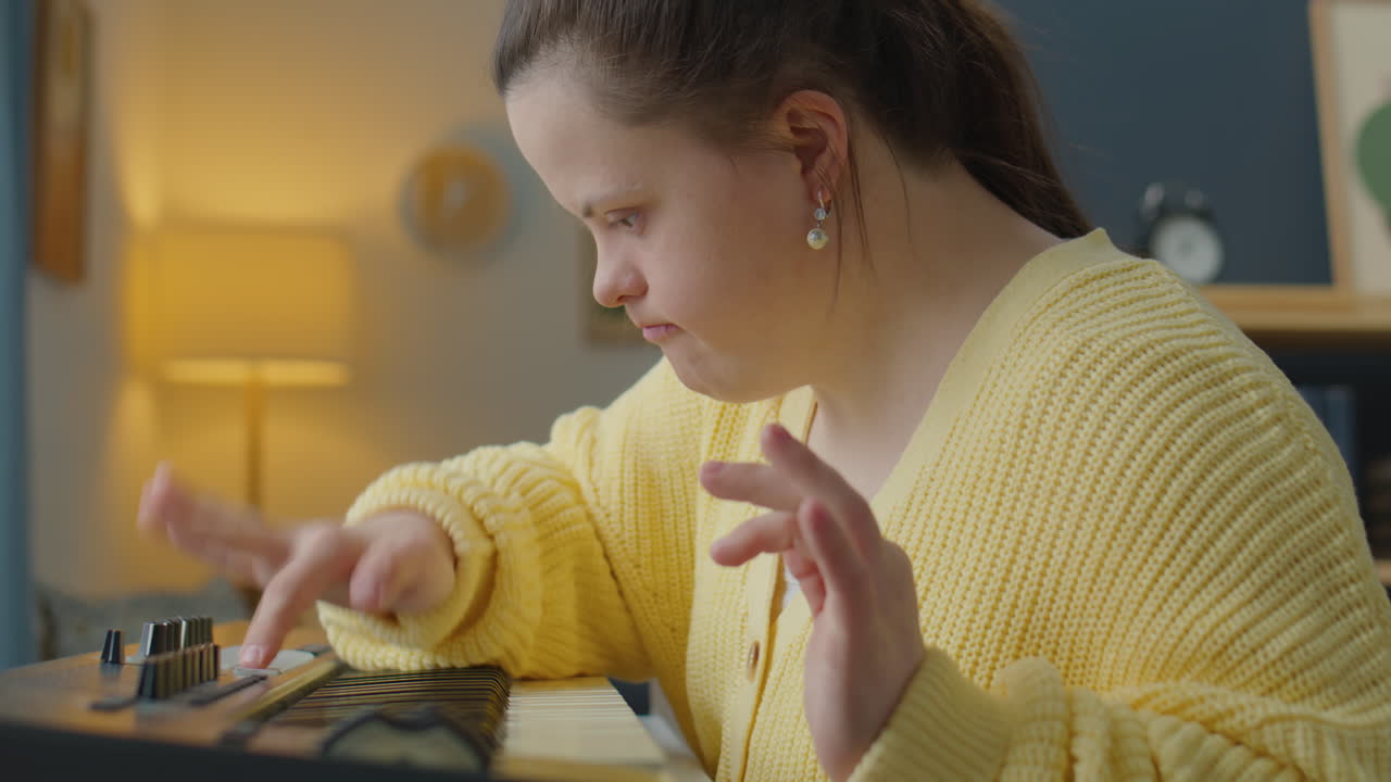 Talented Girl with Down Syndrome Playing Synth