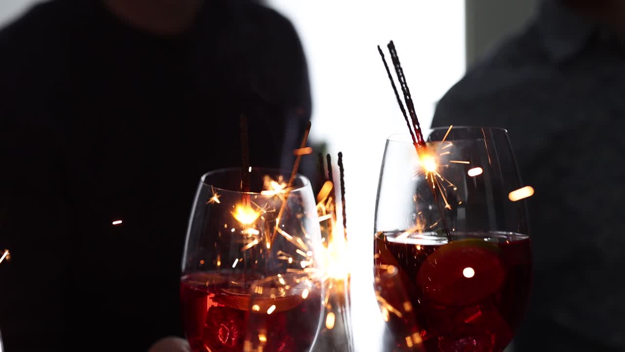 Festive Drinks with Lit Sparklers at a Celebration