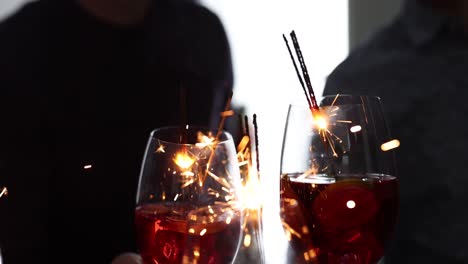festive drinks with lit sparklers at a celebration