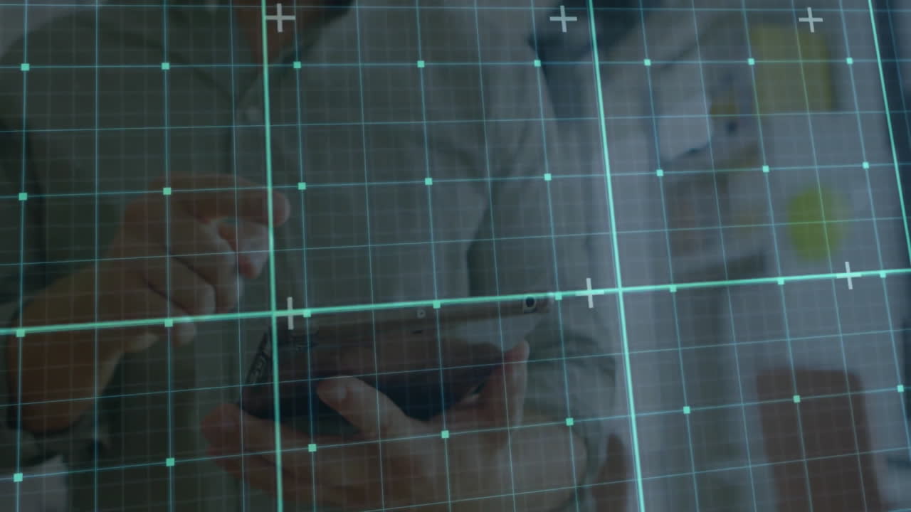 Using tablet with digital grid overlay, person engaging with animation technology