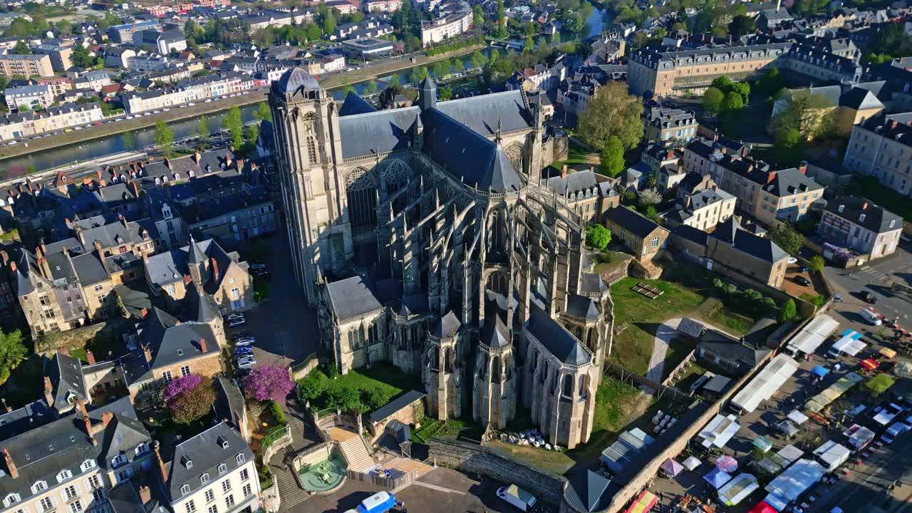 Amazing top-down perspective drone view of the gothic Cathedral of Saint Julian of Le Mans with Market Des Jacobins, Le Mans, France.