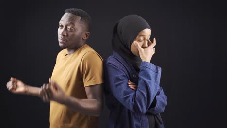 muslim african couple are unhappy and overwhelmed in their marriage or relationship.