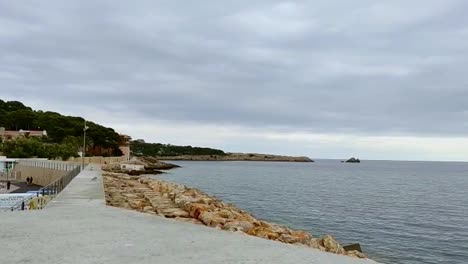 cala ratjada breakwater of large stones on the coast of palma de mallorca