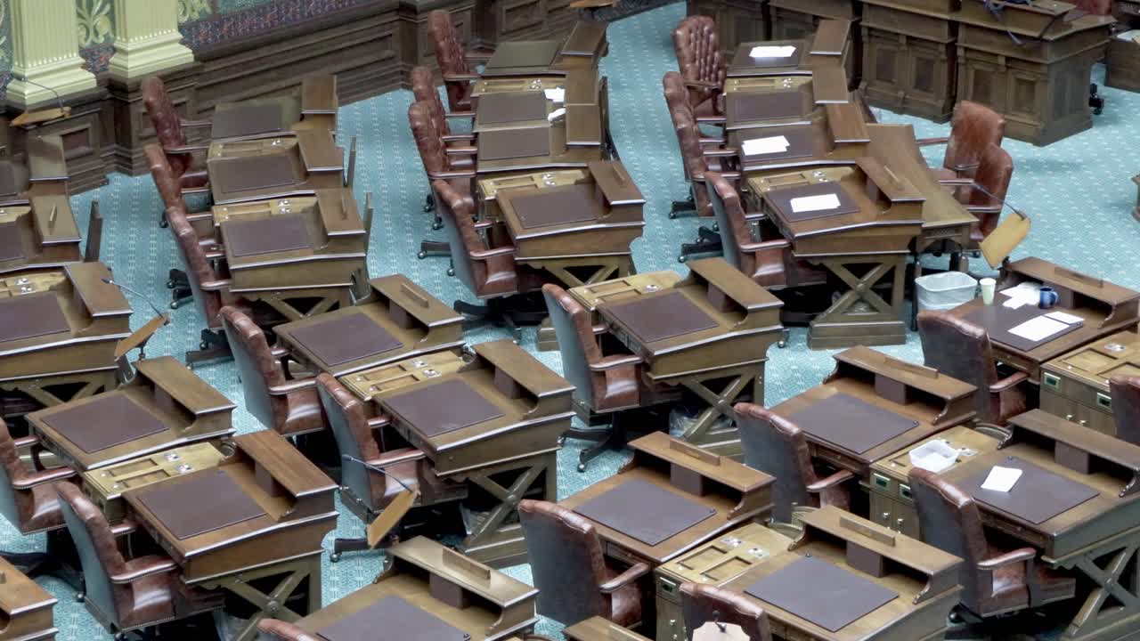 Michigan House of Representatives chamber desks inside the Michigan state capitol with stable close up video.