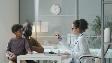 African-American-Father-and-Child-Having-Consultation-with-Female-Pediatrician