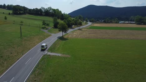 Six-Ambulance-Cars-driving-fast-in-a-Convay-with-blue-Lights-switched-on,-4k-Drone