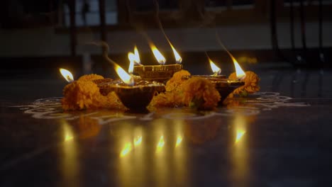 diya lamps lit during diwali celebration of indian hindu light festival called diwali, rengoli decoration during deepavali