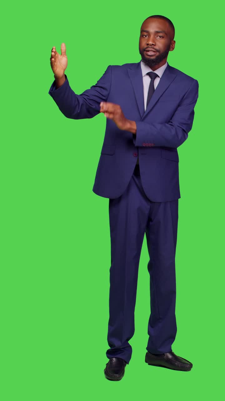 Vertical video: Front view of male entrepreneur creating advertisement on camera