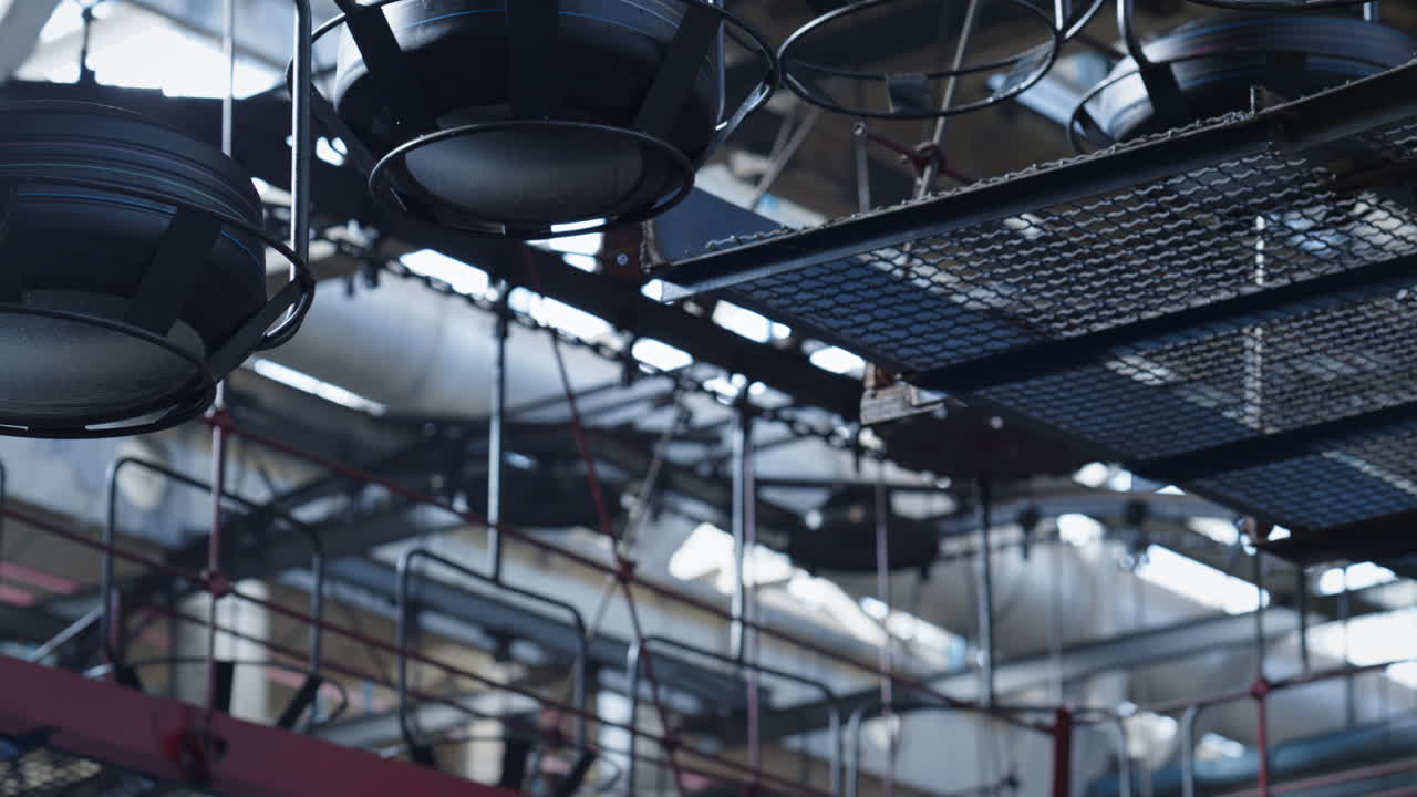 Tyre factory conveyor moving new black rubber auto production automatically