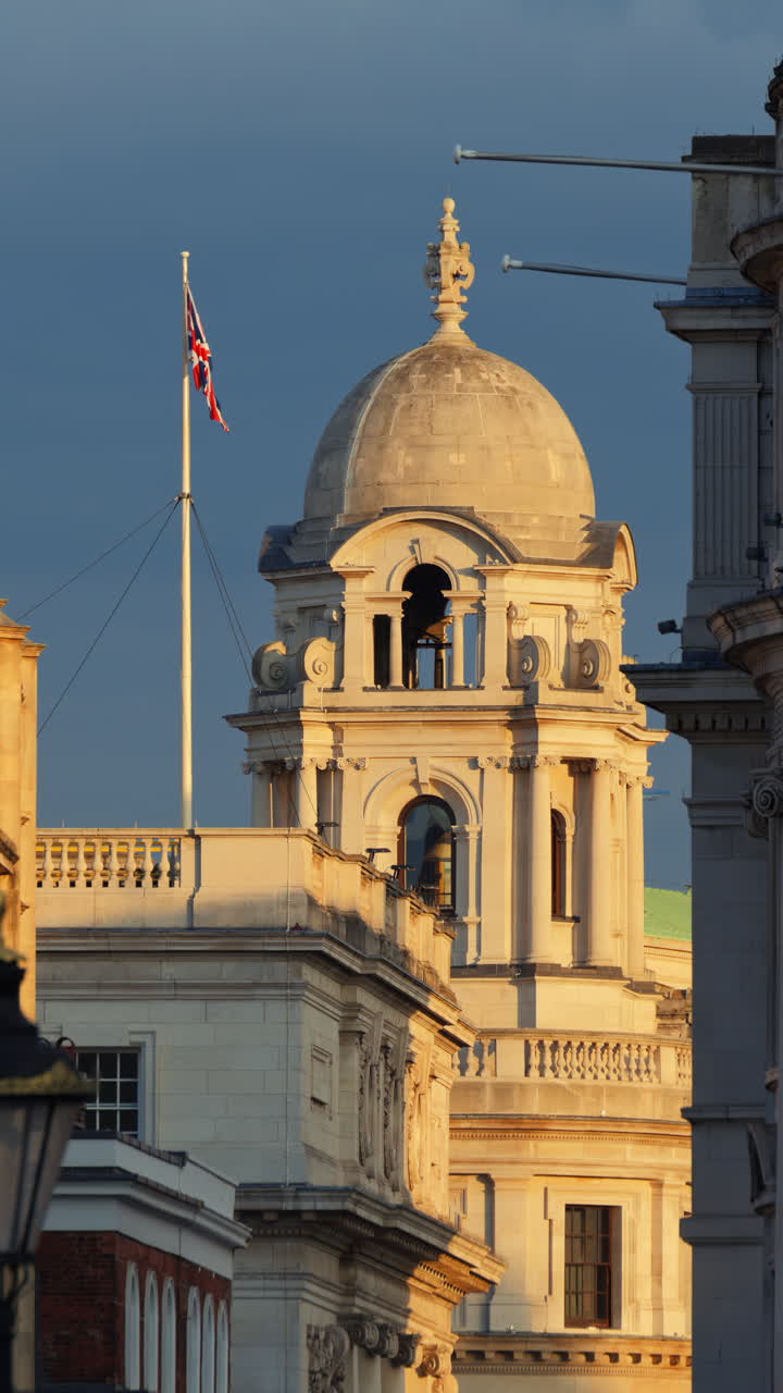 Scenic view of classic streets featuring historic white stone buildings in London, England. Vertical