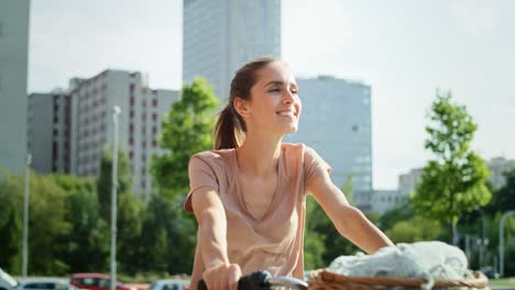 video of happy young woman going by bike