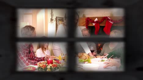 familia en navidad vista a través de la ventana