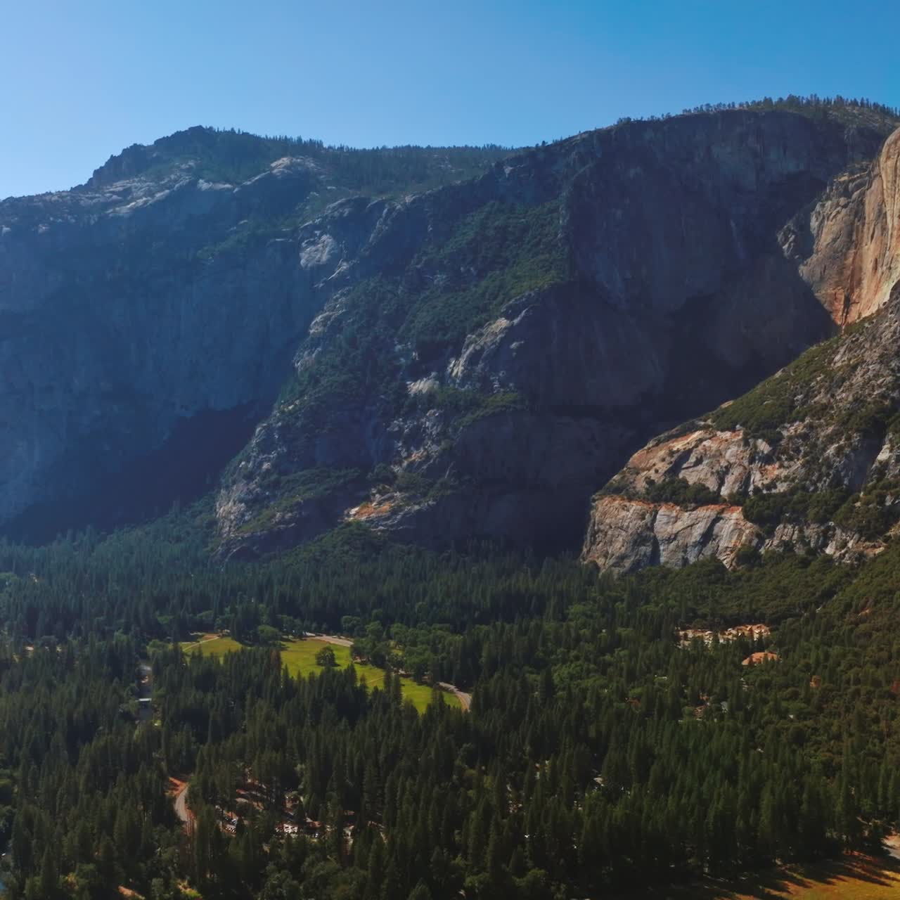 Fascinating mountains in the rays of bright sun with amazing beautiful valley at foot. Splendid blue clear sky at backdrop