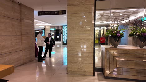 professional collaboration: hotel staff discussing workflow in a luxurious setting