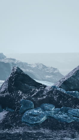 a dramatic landscape with icy mountains