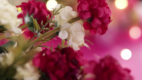 Artificial-flowers-with-unfocused-background-and-lights-in-the-distance