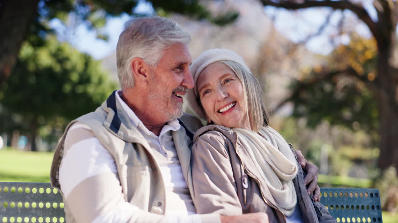 Happy senior couple enjoying time together in the park