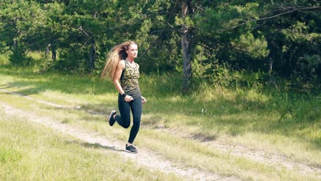 young girl goes in for sports in the morning runs along a pine forest collects magnificent hair in neat tail