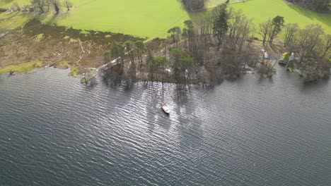 aerial view of steamer boat in the calm waters of ullswater lake in lake district, england