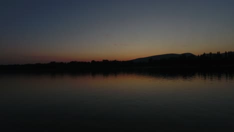 static aerial shot of a sunset, or sunrise over water